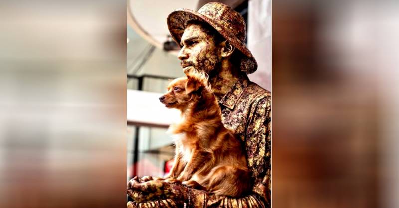 Pup plays along with a statue street artist and they go viral